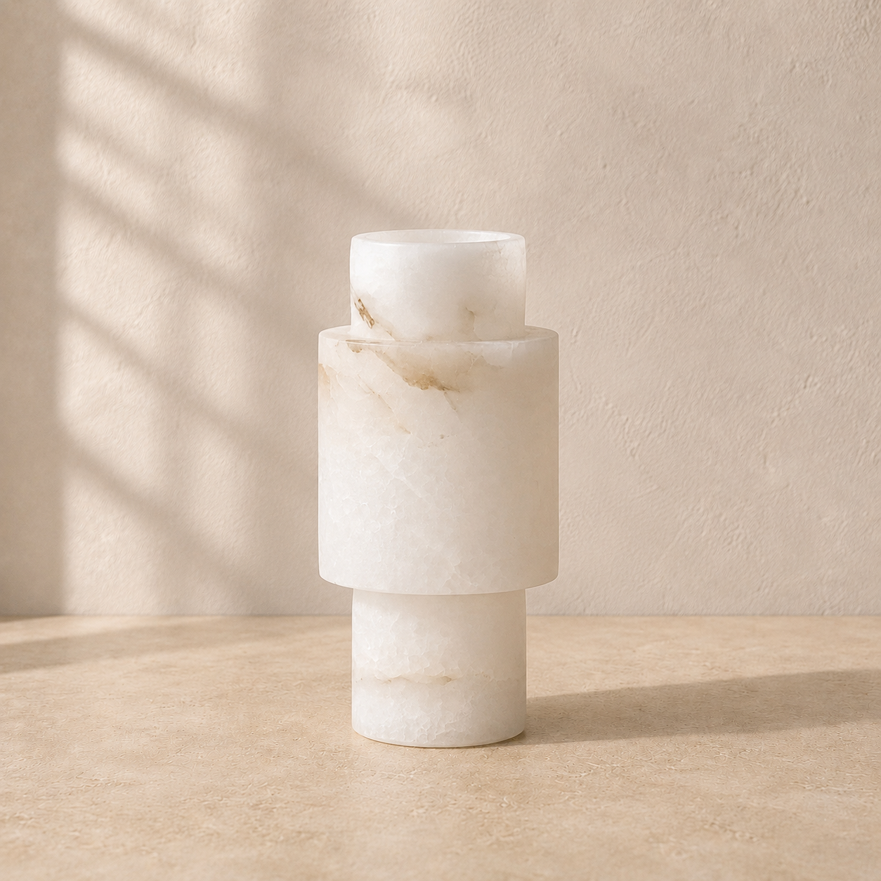 The Reveal, a Spanish alabaster vase by Lomāe, twelve centimetres across and twenty-six tall