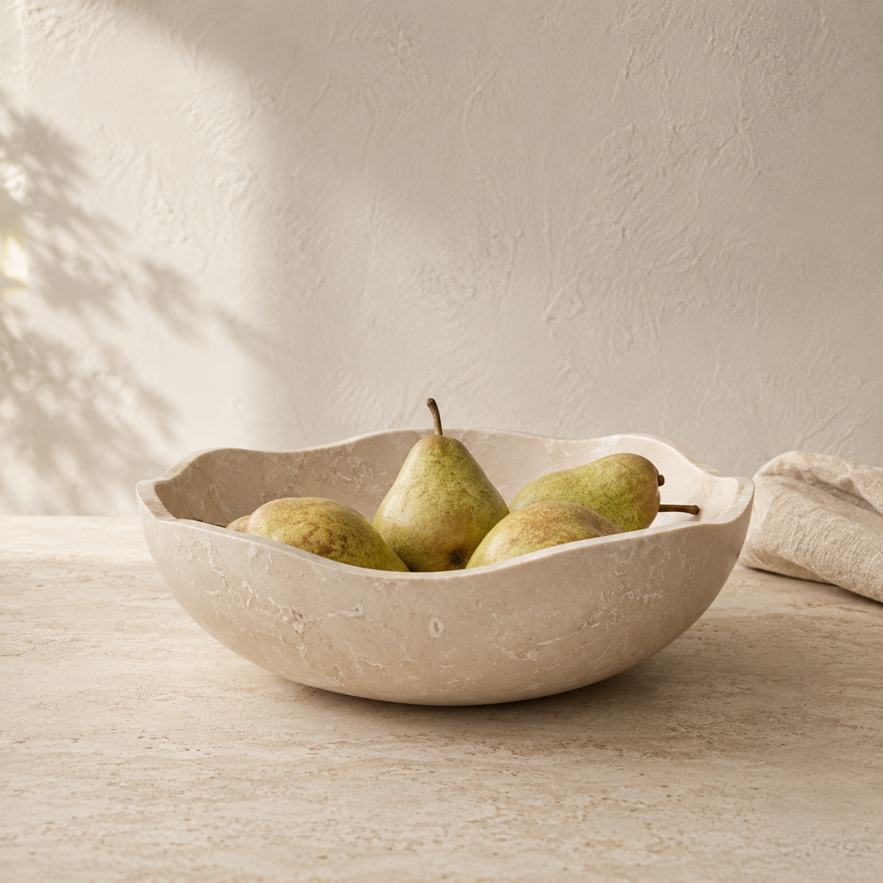 Cream marble Waitākere bowl showing natural veining and soft tonal range