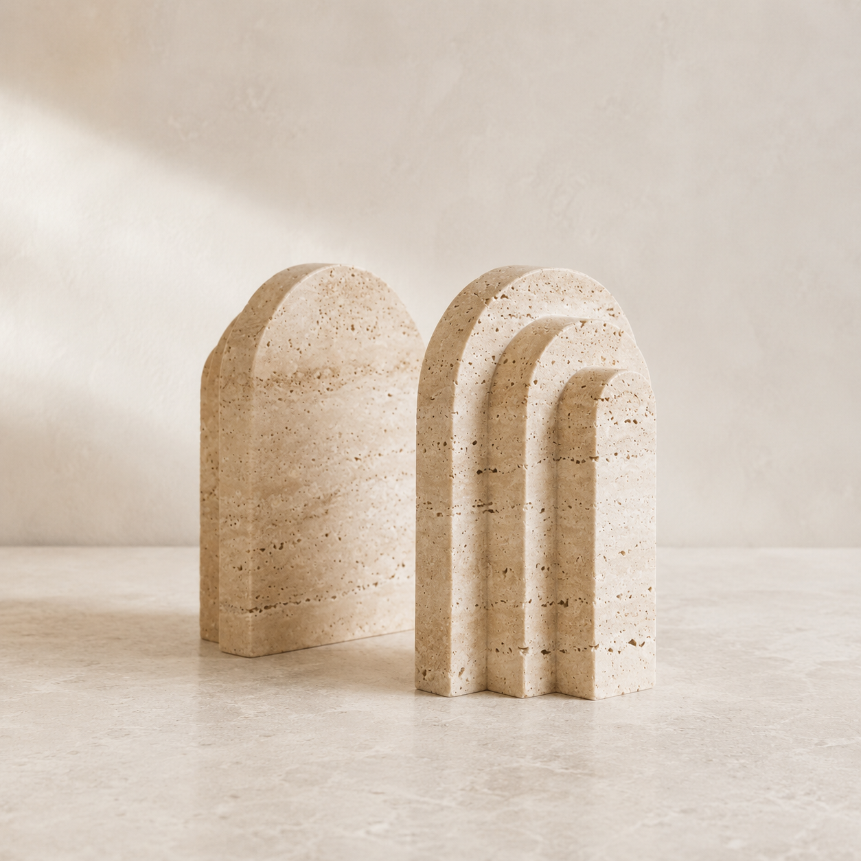 The Lintel, a pair of yellow travertine bookends by Lomāe